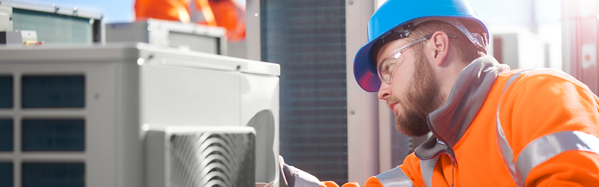 Technician repairs ventilation system